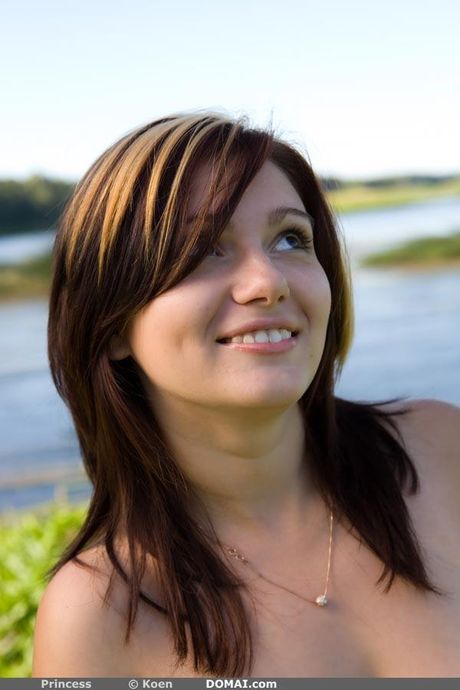 Brunette teen Princess models totally naked on a rocky beach