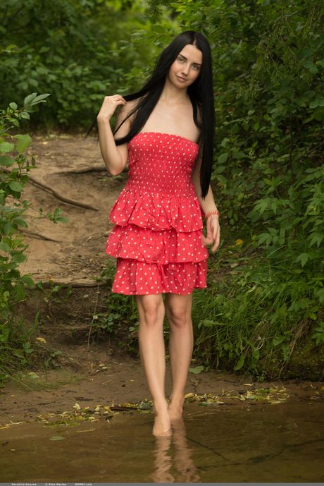 Lean teen Veronica Snezna shows her small tits and poses nude in a solo