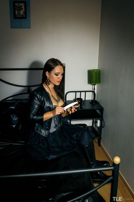 Tattooed teen Lola Ash removes her bikini before fingering her pussy on a sofa