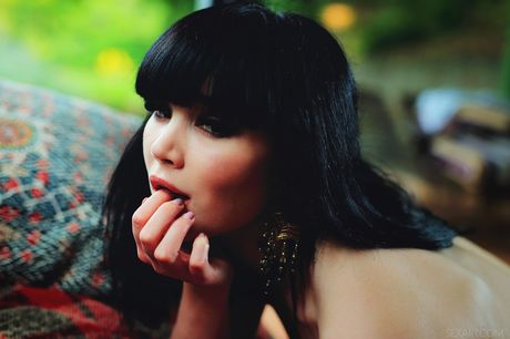 Ukrainian fair Malena fingers her pussy after getting naked