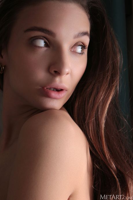 Thin teen Santa removes her clothes and poses nude