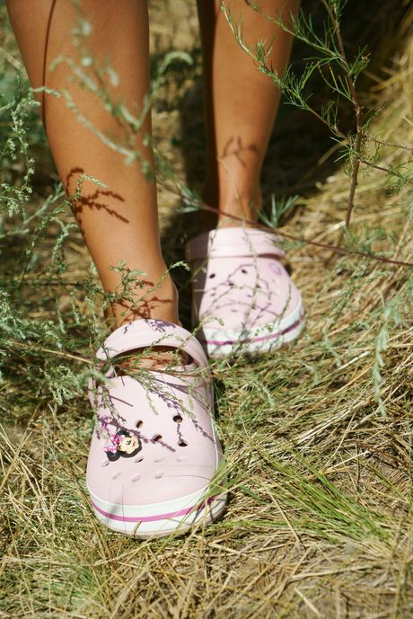 Sybil A takes off her clothes and poses naked in a field