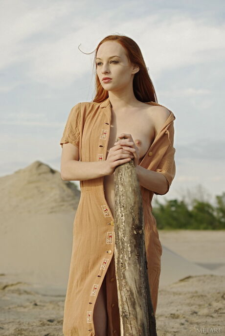 Sally A in her red dress posing naked on the beach to show her hot body