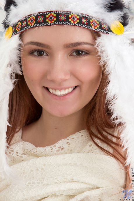 Bashful teen Foxy removes her dress and lingerie before fingering her pussy