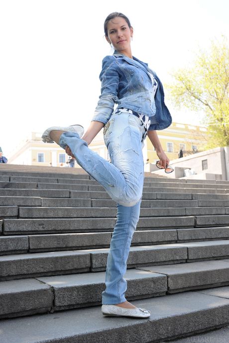 Angelic teen Suzanna A removes her jeans to pose nude on the stairs