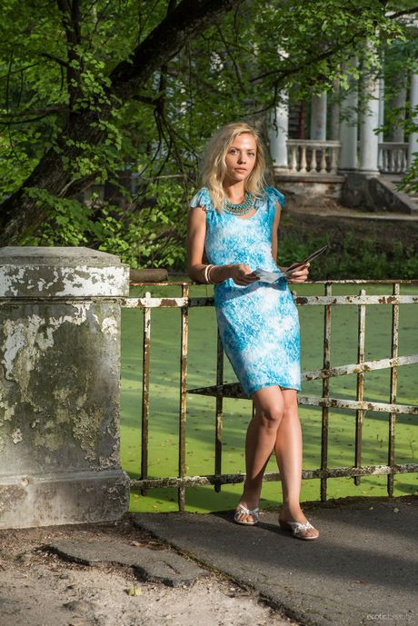 Slim teen Camelia shows her tiny tits and poses naked in a solo shoot