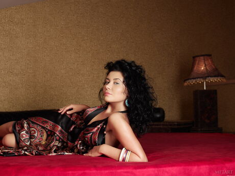 Young brunette Alba B gets naked in an enticing manner during solo action