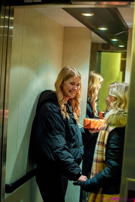 Blonde beauty Elza and her girlfriend Lesya have sex on a couch