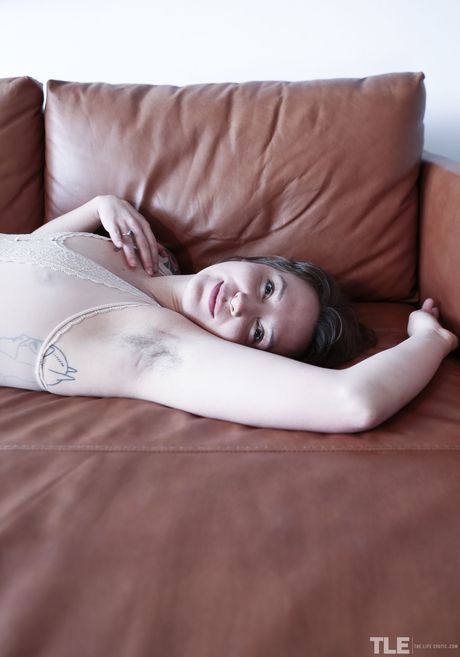 Horny teen Kit Bauer removes a blindfold before masturbating with a dildo