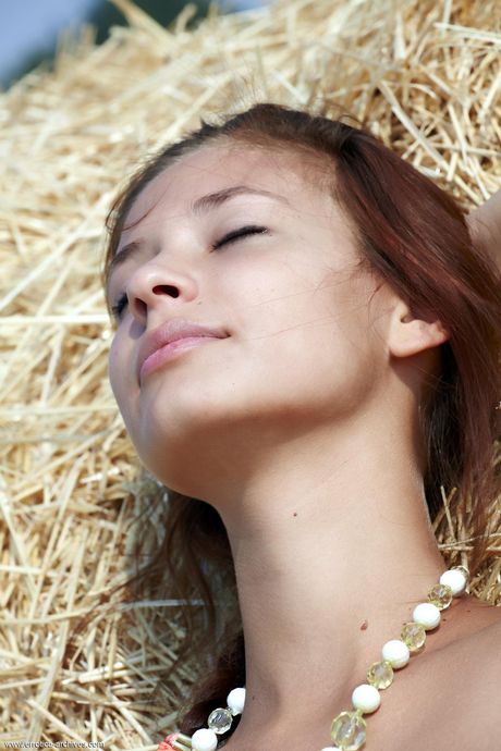 Alluring teen Afrodita strips naked in the backyard & shows her hot body