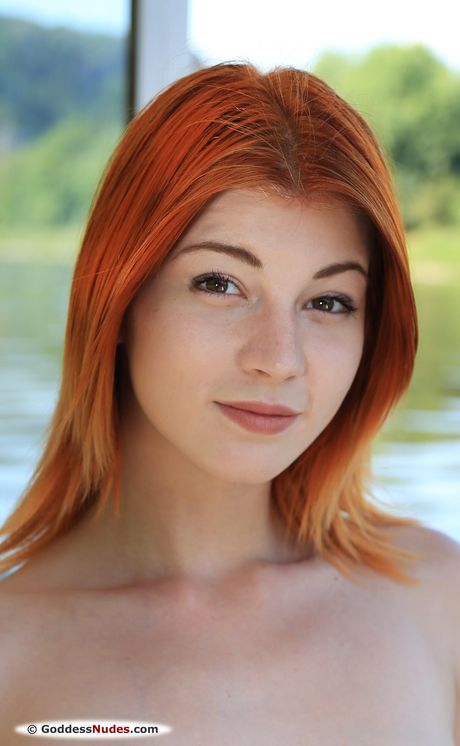 Nessie Blue shows her sexy body and big tits as she poses outdoors