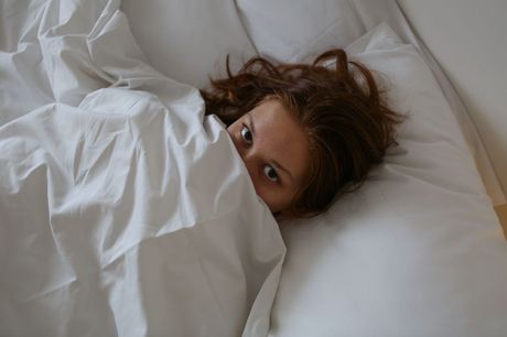 Young redhead Lulu plays with her trimmed pussy while wearing a gag