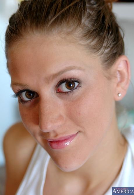 Blonde babe Eve Laurence strips and shows her shaved pussy in a solo