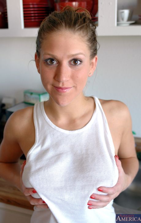 Blonde babe Eve Laurence strips and shows her shaved pussy in a solo