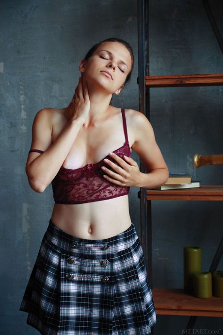 Sexy Ukrainian cutie Ella Green removes her lingerie and poses naked