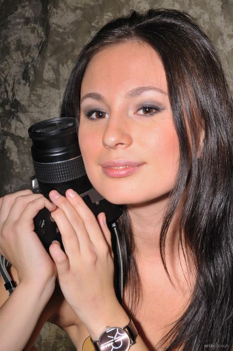 Charming teen Bianka A strips her dress & reveals her big tits & bald pussy