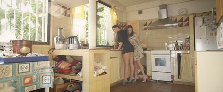 Teen lesbians Henessy A & Kira Queen kiss before licking pussies in the kitchen