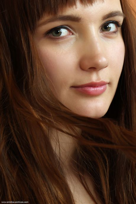 Skinny Russian venus Aria Bella shows her big tits and hairy pussy in the nude