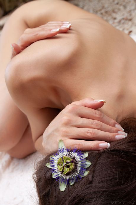 Svelte teen Megan Muse removes a dress to pose nude on a patio