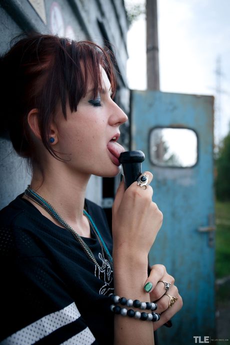 Redheaded teen Bree Haze smokes a cigarette after masturbating in knee socks