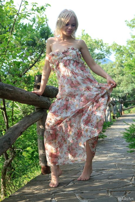 Precious teen Feeona strips naked on a balcony to show her bald pussy