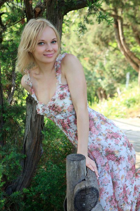 Precious teen Feeona strips naked on a balcony to show her bald pussy