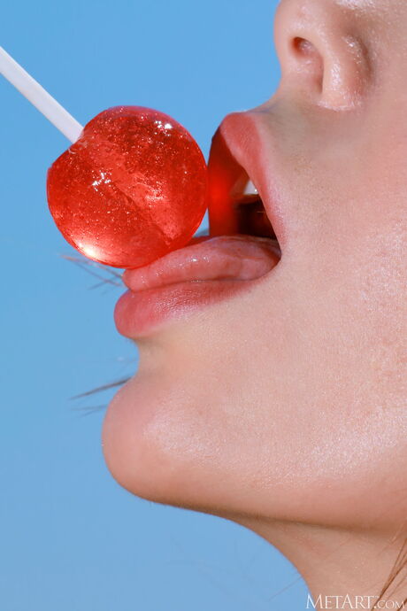 Petite teen Alice Wonder bares herself on a cliff overlooking the ocean