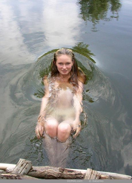 Skinny teen Tina goes nude in a bathtub while taking a bubble bath