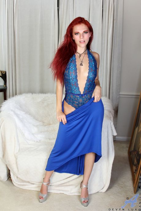 Redheaded MILF Devyn Lux toys her mature pussy with a glass dildo