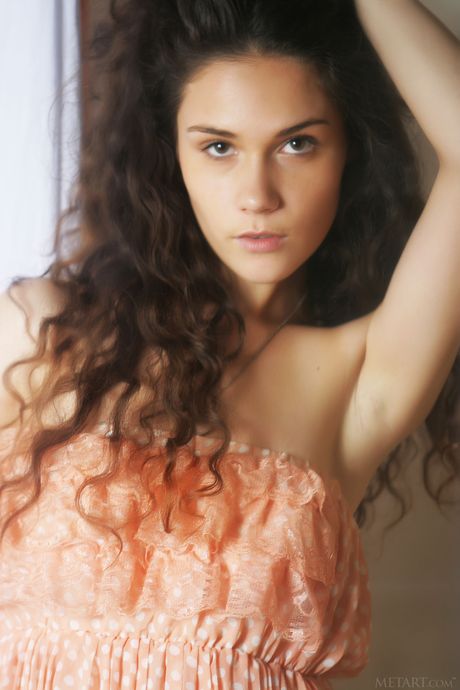 Svelte teen Ira J shows her big tits and poses naked