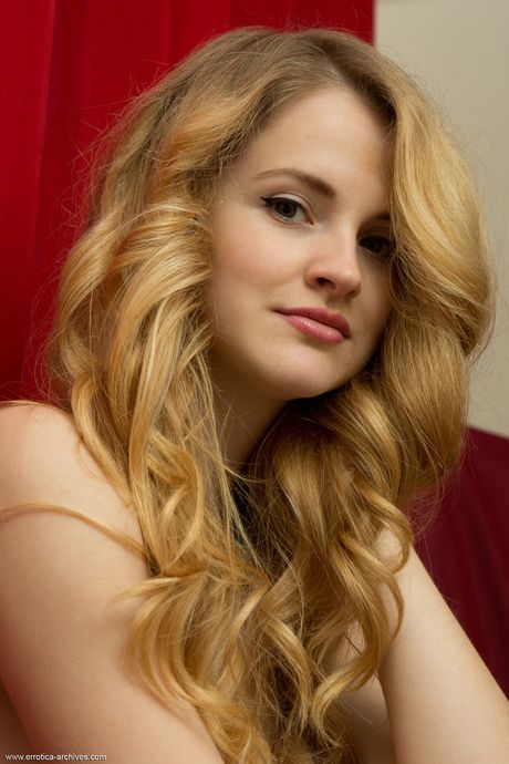 Skinny redhead Alice May displays her naked body fearlessly