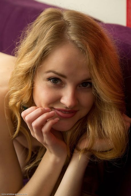 Skinny redhead Alice May displays her naked body fearlessly