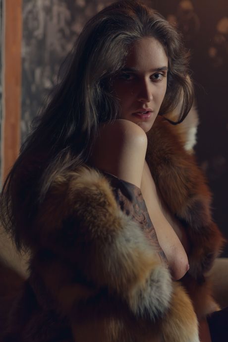 Emily J presents her big tits and meaty pussy as she strips off her lingerie