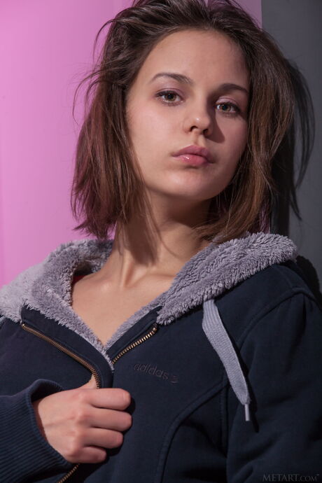 Brunette teen Tirata gets naked with certainty during a solo shoot