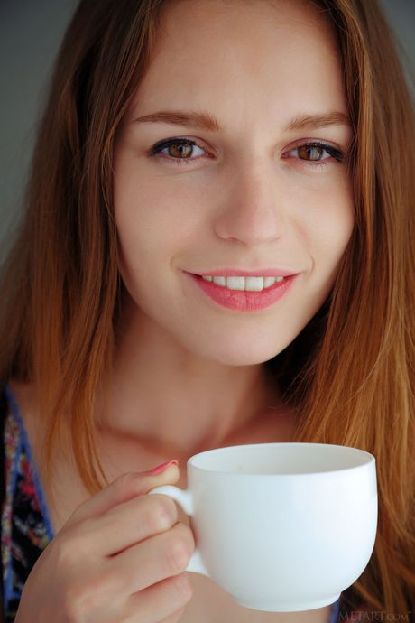 Sexy redhead Sofi Shane strips & displays her hairy pussy in a solo