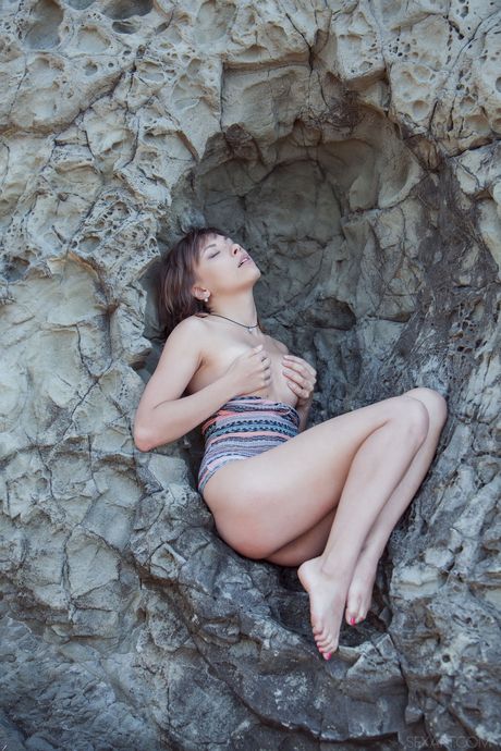 Skinny Ukrainian lovely Eddison masturbating her pussy outdoors