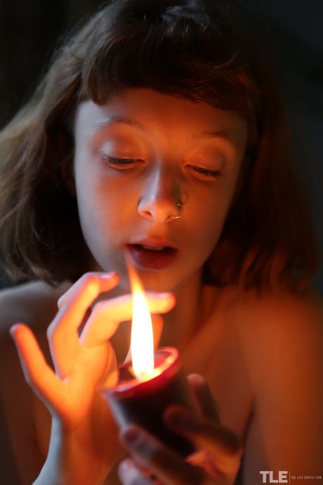 Tall blonde Sondrine removes her lingerie to finger her trimmed pussy