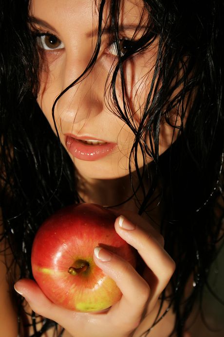 Brunette teen Kitty M removes a bikini before showering in a bathtub