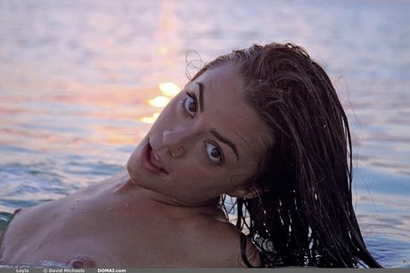 Precious teen Layla shows her beautiful body and poses naked on a beach