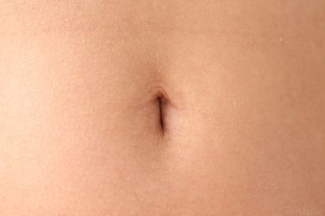 Taylor Sands strips off her white skirt and exposes her big tits and bald pussy