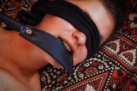 Briz is getting her kink on, wrists bound as she caresses and spanks herself