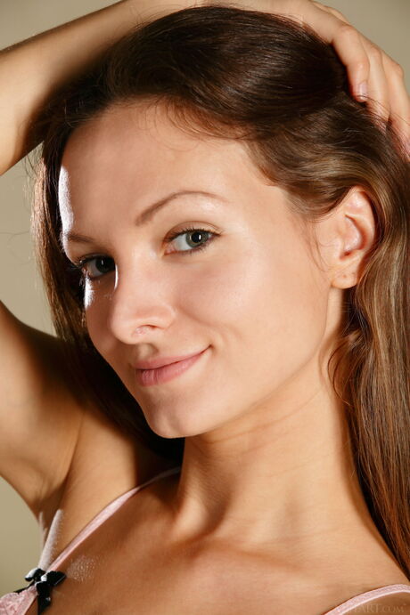 Brunette teen Zhanet A removes a bikini to pose nude with grace