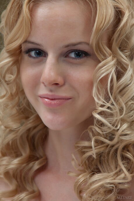 Sexy blonde teen Sasha R exhibits her big tits and poses naked