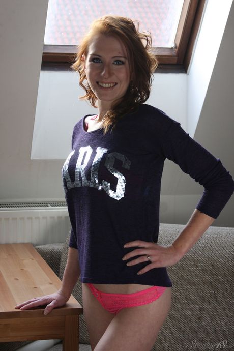 Young redhead Hanka bares her body in a confident fashion