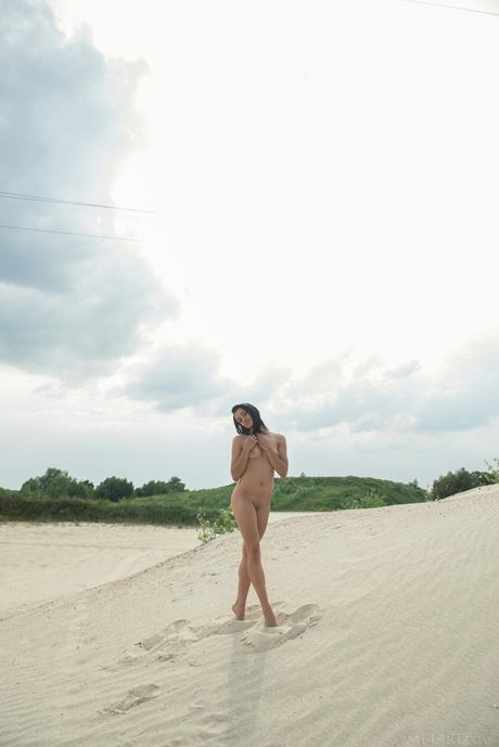 Lean teen Aprilia B poses nude on the beach & in the water