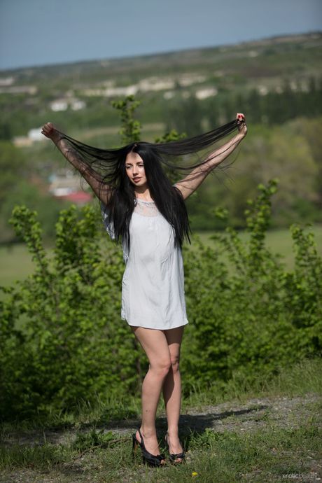 Lean teen Veronica Snezna gets naked on a hill without embarrassment