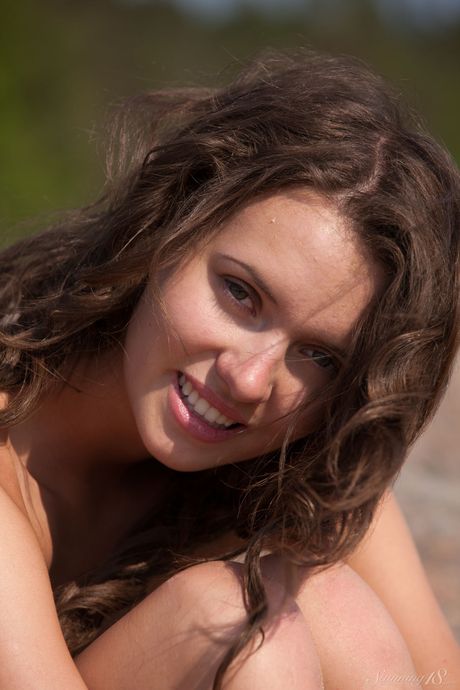 Adorable teen Lucy G takes it all off on a rocky beach