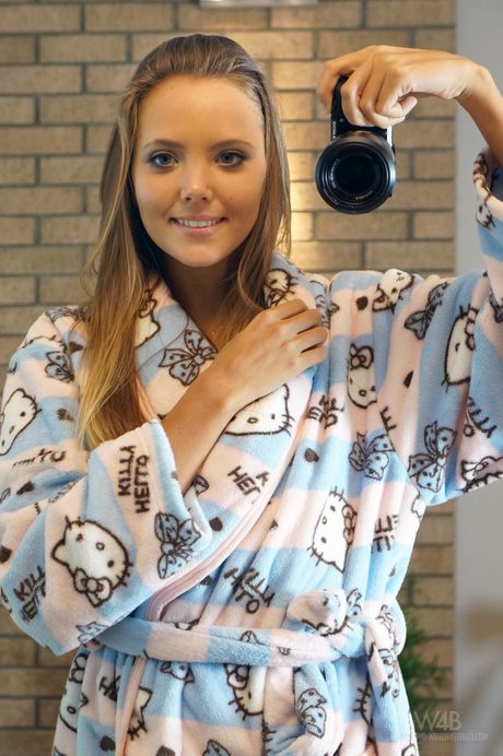 Dark haired teen Clover takes selfies of her pink pussy in a mirror