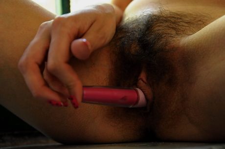 Young blonde Daniela fingers her pussy while naked on a bed