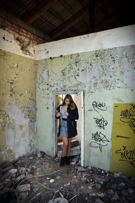 Alluring teen Izabella K strips to her boots and fingers her pussy outdoors